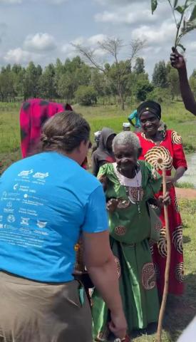 Amber Hurst dancing with 120 year old villager, Sophia. Photo credit: Hope 4 Kids International