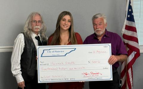 Hannah Smith receives a $500 scholarship from Vice Mayor Phillips and Mayor Beeler.