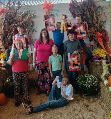 Back Row (Left to Right): Reed Reno, Jude Firkin, Asher Firkin Middle Row (Left to Right): Aaliyah Hill, Sarah Stokely-Cook (4-H Agent), Caleb Firkin, Lucas Headrick Front Row: Virginia Firkin