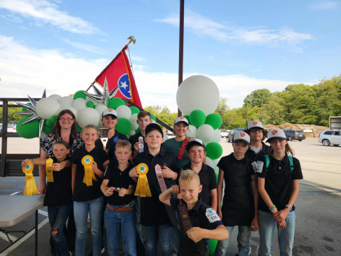 Back Row (left to right): Sarah Stokely-Cook (4-H Agent), Colt Davis, Sam Davidson, Madeleine Groce, Bennett Smith Middle Row (left to right): Coral Davis, Aspen Davis, Asher Firkin, Caleb Miller, Jaxson Moore, Jude Firkin, Virginia Firkin Front Row: Caleb Firkin Not Pictured: Ariona Payne & Brandon Davis (4-H Volunteer Leader)