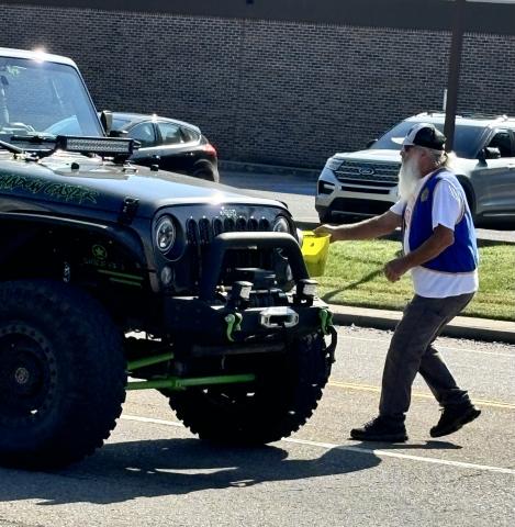 Dodging traffic for American Legion support