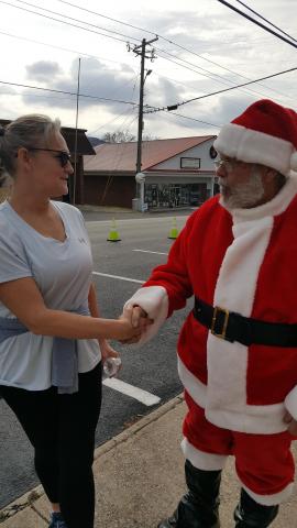 woman shaking hands with Santa