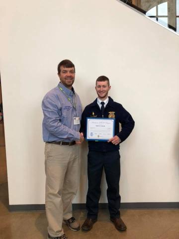 Pictured, John Fugate with Tyler Sweet after receiving his American FFA Degree at National Convention 