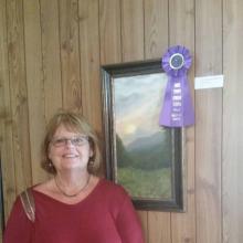 Debbie Toney with her painting Good Morning Clinch Mountain