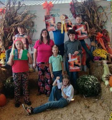Back Row (Left to Right): Reed Reno, Jude Firkin, Asher Firkin Middle Row (Left to Right): Aaliyah Hill, Sarah Stokely-Cook (4-H Agent), Caleb Firkin, Lucas Headrick Front Row: Virginia Firkin