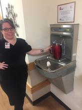 Willow Ridge charge nurse Kelly Pittman uses the new water fountain to fill a pitcher.
