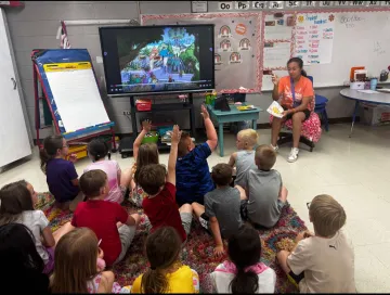 TAP students reading to elementary students at Luttrell Elementary School